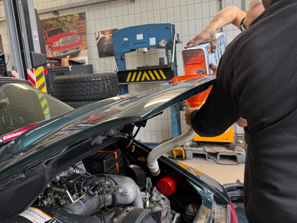 Marque specialists servicing an air-cooled Porsche engine